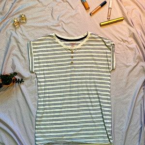 This shirt is white and blue striped. It has buttons in the front, and is comfy.